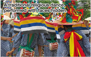 A traditional religious dance, performed with faces hidden.